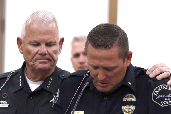 Salem Police Chief Brad James, left, puts his arm around Santaquin Police Sgt. Mike Wall during a press conference Sunday after a Santaquin police officer was hit by a vehicle and killed.